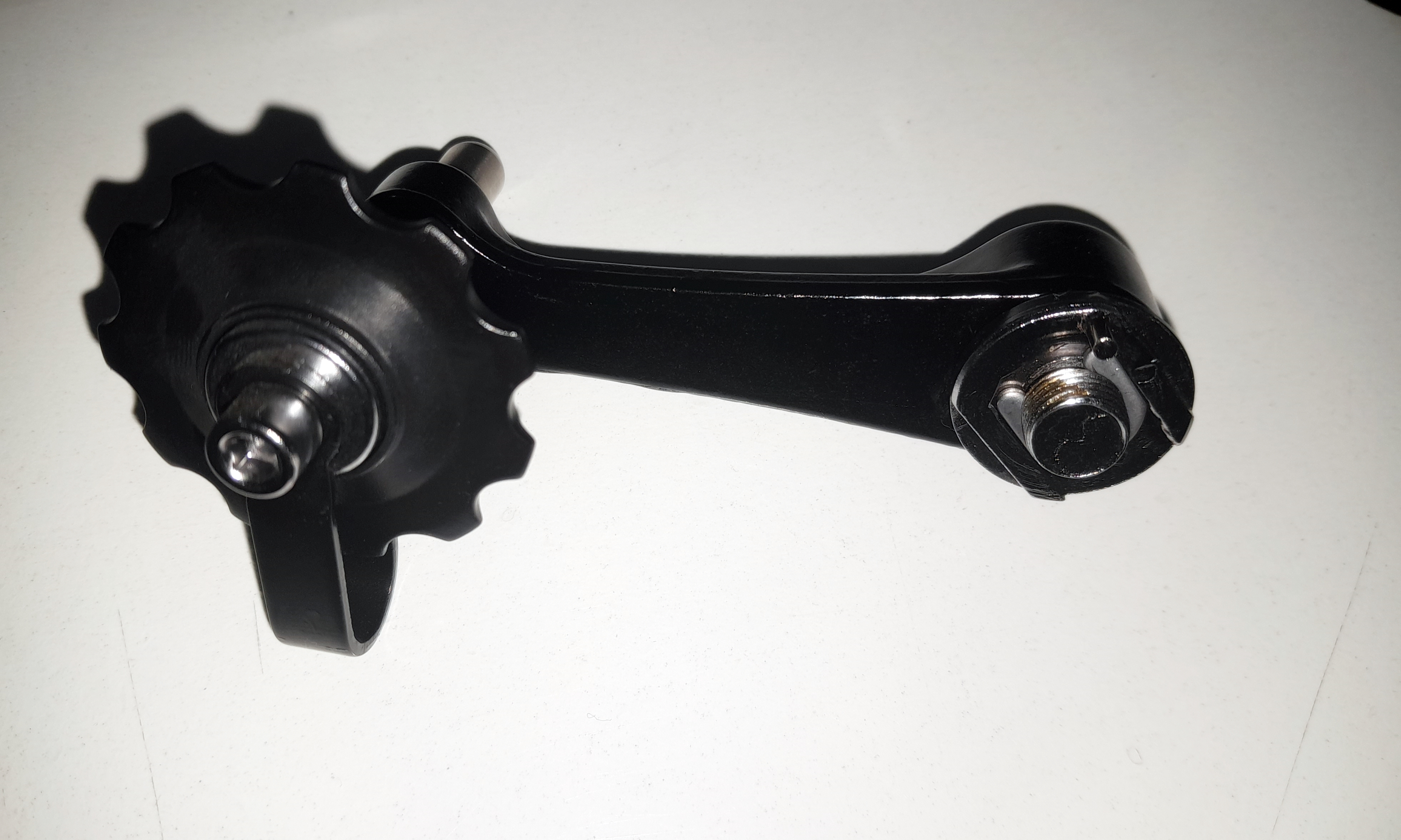 Chain tensioner | alloy | black | with return spring | Attachment to the dropout